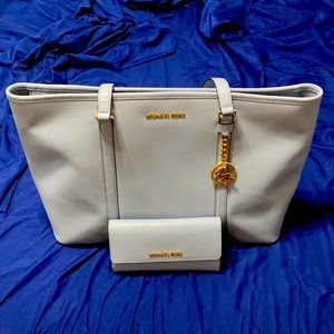 Light blue tote bag from MK with wallet